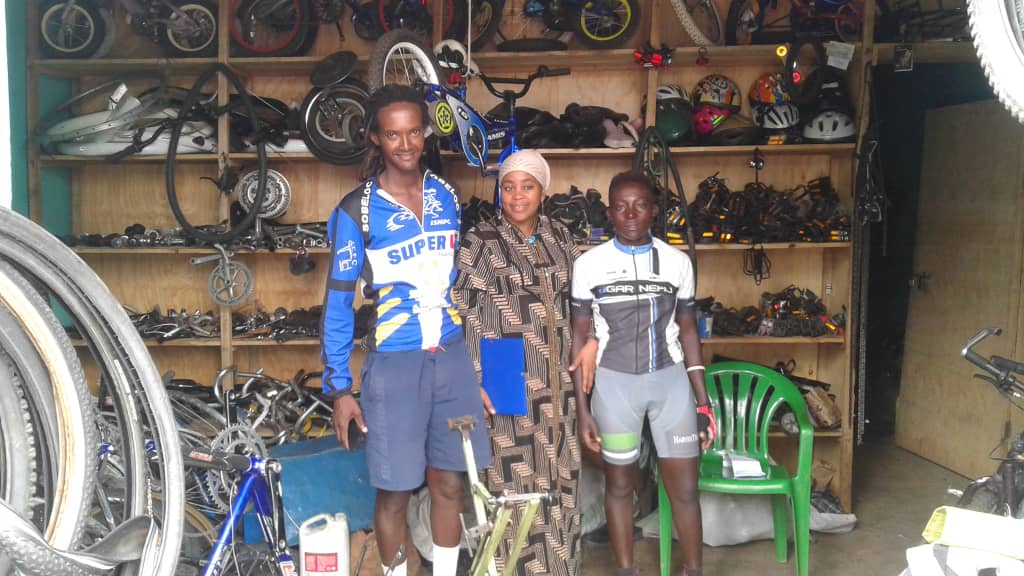 2018-10-22 at 1.34.31 PM-Michael Kamanzi the cycling player from Kigali cycling club and Saidat Mutimucyeye from Muhazi cycling club are very happy to find some spares for their bikes.