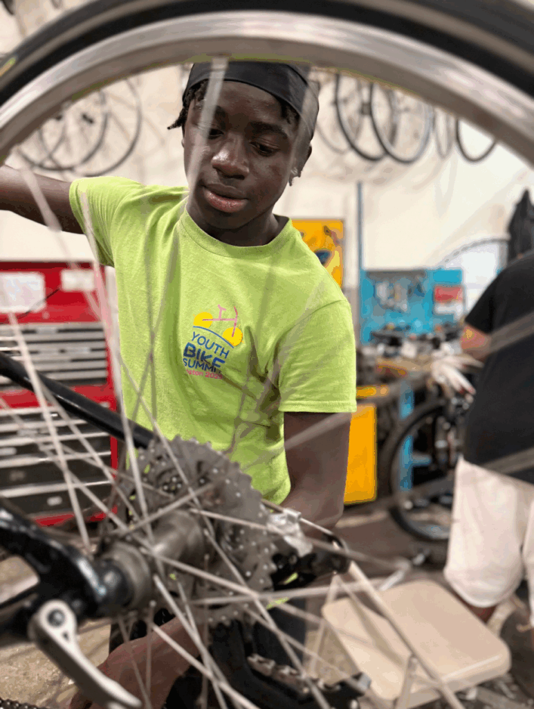 Wislem working on a bike